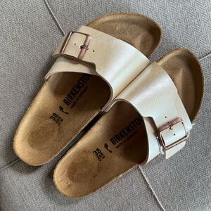 Birkenstock Off-White Slides with Rose Gold Buckle